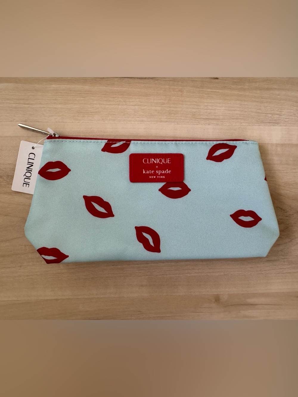 Clinique x kate spade Cosmetic Pouch in Light Blue with Red Lip Print